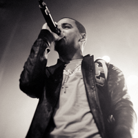 Singer performing live on stage, black and white shot