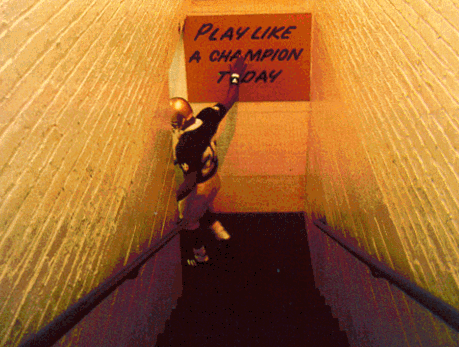 Player touching 'Play Like a Champion Today' sign