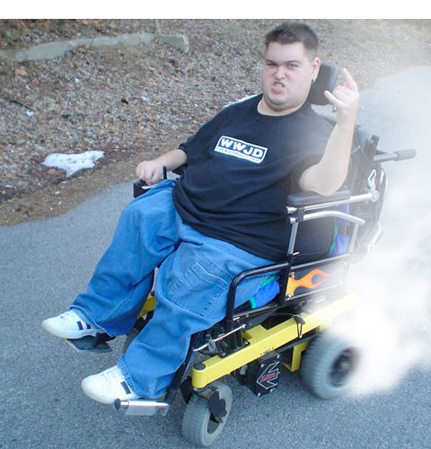 Guy in power wheelchair throwing up the middle finger