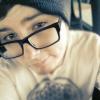 Selfie avatar with beanie and glasses, forum profile pic vibes