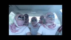Masked crew in shemaghs vibing in a car