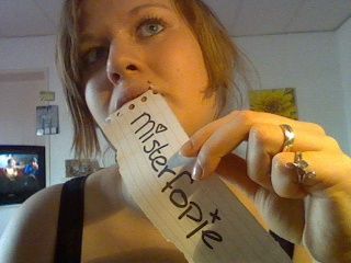 Forum member biting a homemade paper bookmark