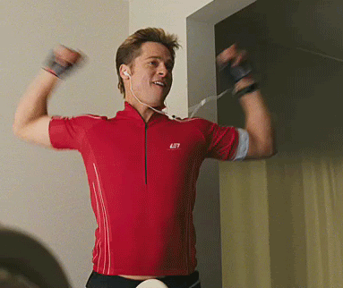 Guy in red cycling jersey celebrating triumphantly
